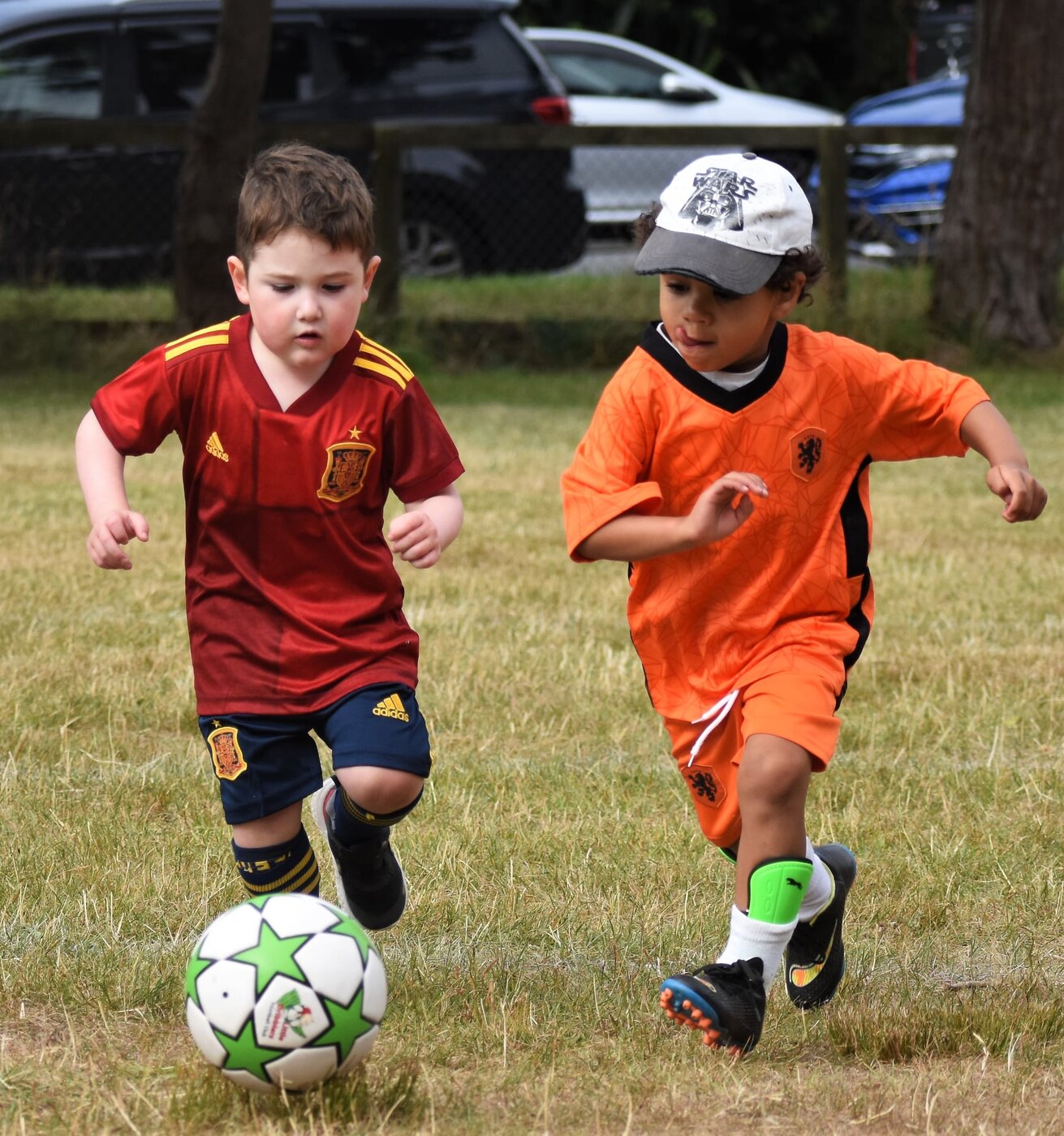 Big Dribblers playing football with the branded green-star ball